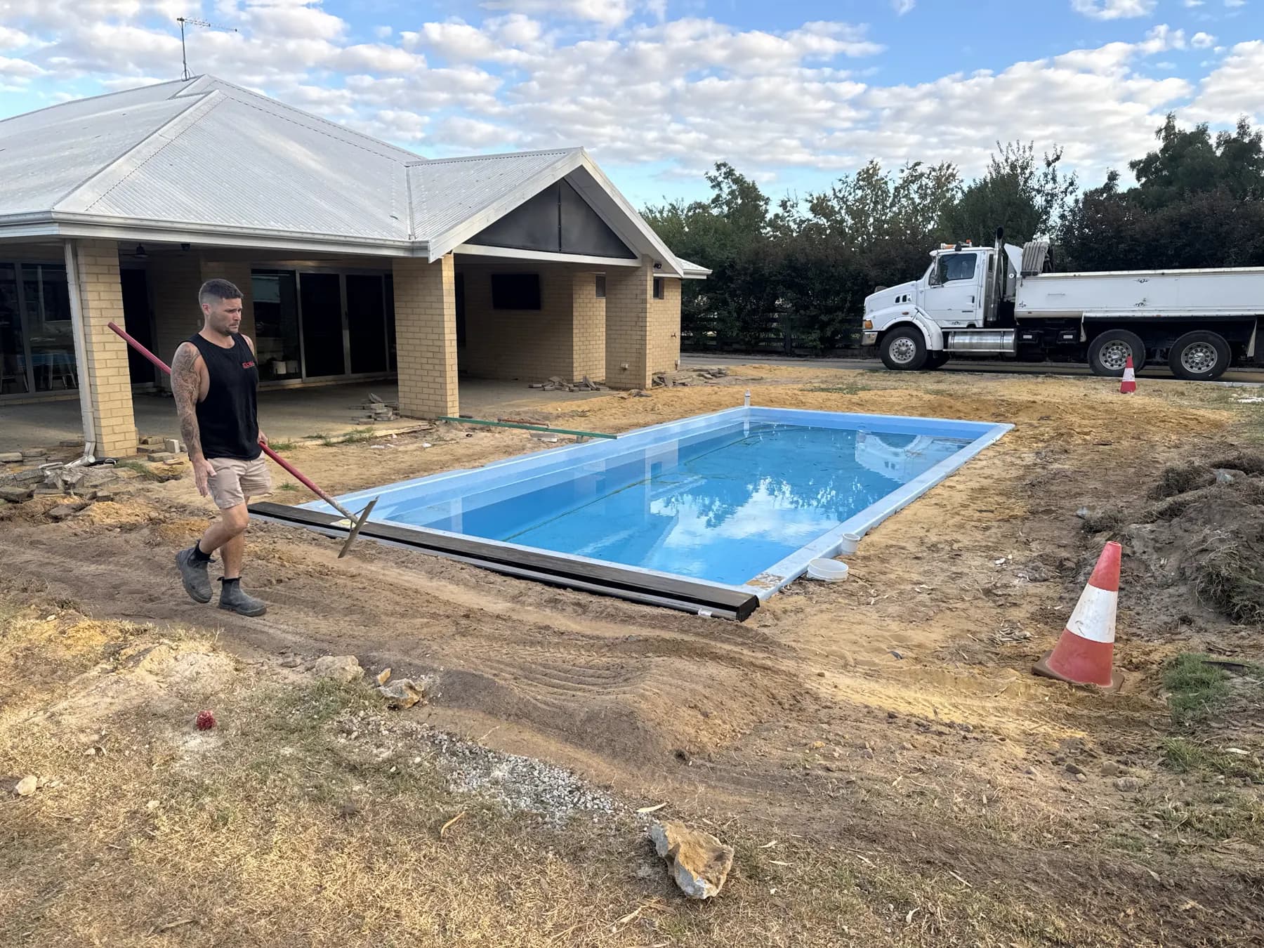 Pool surround area being prepared beside a home before concrete work begins